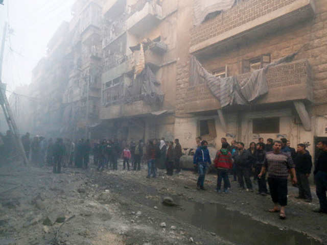 Residents inspect damage at Aleppo in Syria