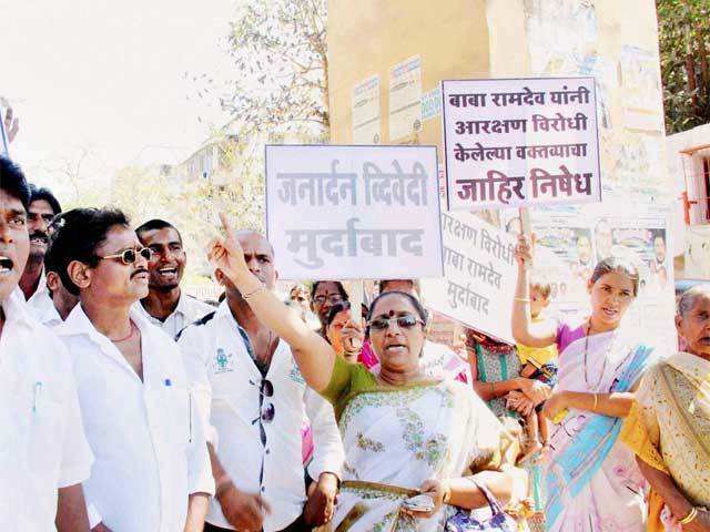 Akhil Bharatiya Adivasi Vikas Parishad members protest against Baba Ramdev, Janardhan Dwivedi