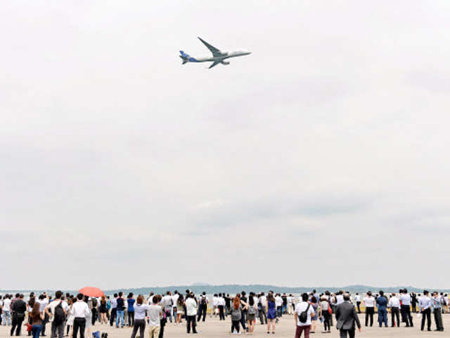 An Airbus A350-900 flies over during the Singapore Air Show