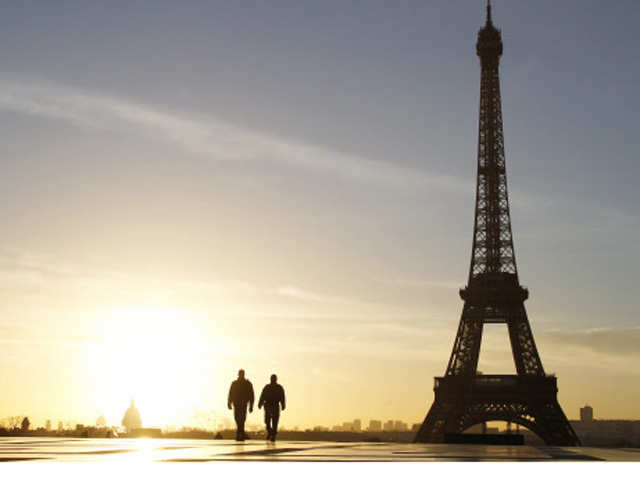 People walking at sunrise on the Trocadero Esplanade