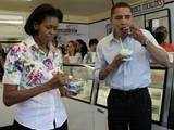 Barack Obama and his wife Michelle eat ice cream