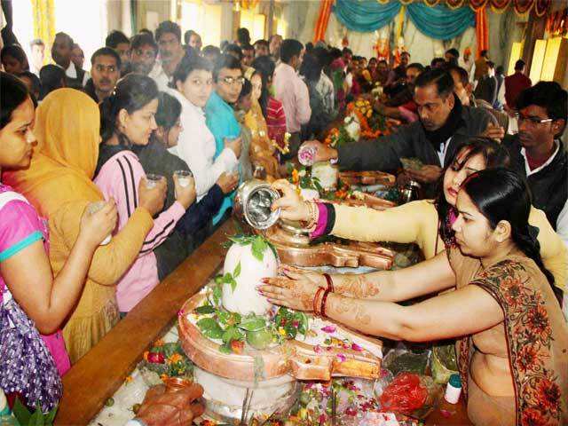 Devotees offer milk to Lord Shiva