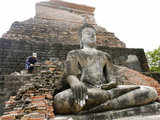 A worker repairs a stupa