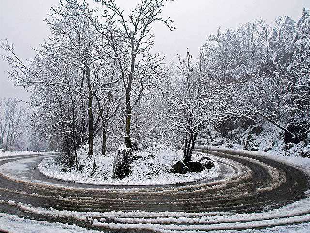 Srinagar: Snow-covered road after a snowfall