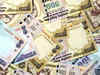 Rupee closes at 61.21 against dollar