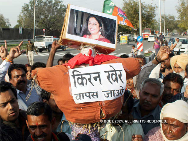 BJP workers burning an effigy of Kirron Kher in Chandigarh