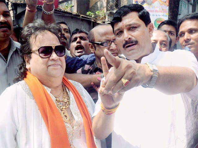 Bappi Lahiri campaigns in favour of a party candidate in Kolkata