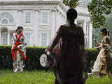 Chinese women near a replica of White House