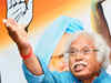 Police detain Madhusudan Mistry as he pastes his posters on Narendra Modi's ad kiosks