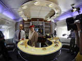 EADS CEO Gallois poses at a bar inside the A380 aircraft