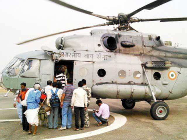 Polling officials boarding a chopper