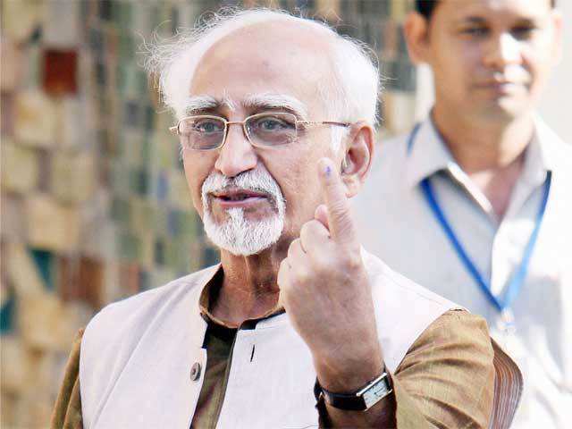 Hamid Ansari shows his ink-marked finger