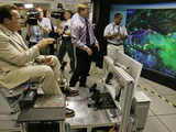 Arnold Schwarzenegger sits in a flight simulator