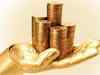 Gold posts modest gain on buying; silver slips