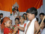 Student tying Rakhi to her colleague