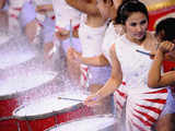 Cheerleaders perform on drums