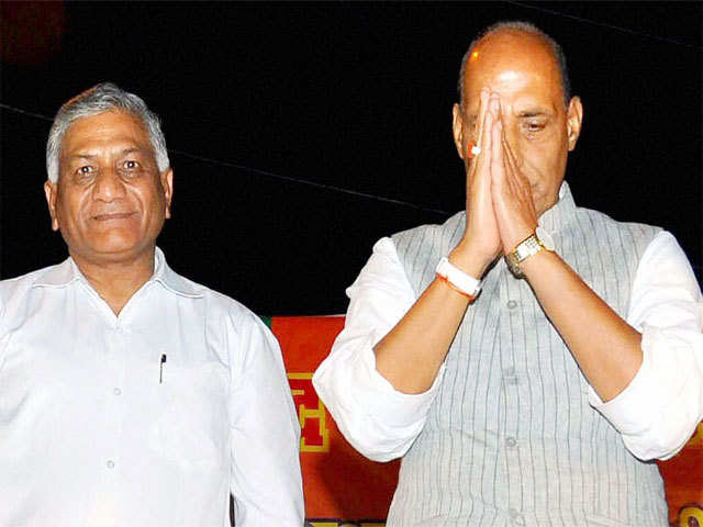Rajnath Singh with party leader V K Singh during an election campaign rally in Lucknow