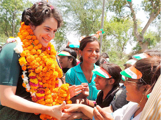 Priyanka Vadra interacts with an old age woman