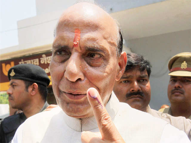 Rajnath Singh shows his inked finger