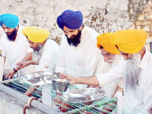 Bikram S Majithia performs ''sewa'' at Takht Sri Kesgarh Sahib