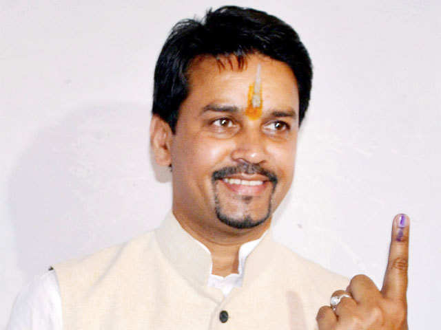 BJP candidate Anurag Thakur shows his inked finger after casting vote for Lok Sabha elections