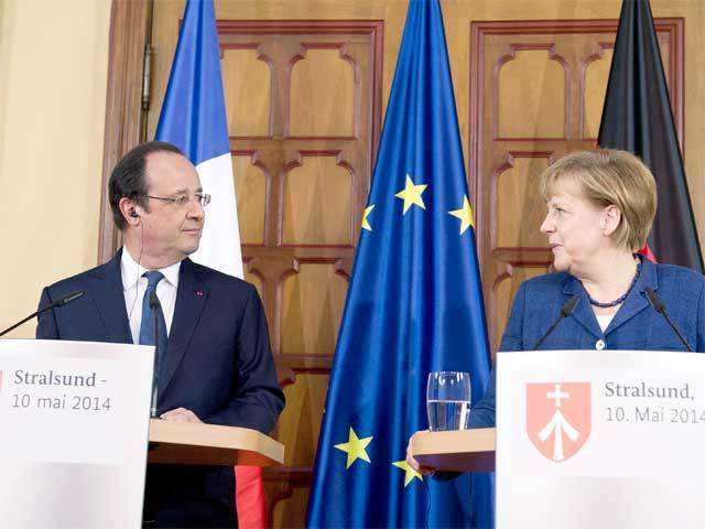 Francois Hollande and Angela Merkel at a press conference
