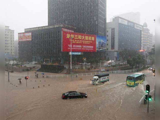 Commuters maneuvering their way through the flood