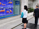 Asian shares rise, euro wobbles under pressure