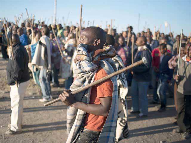 Striking miners march in Marikana, South Africa