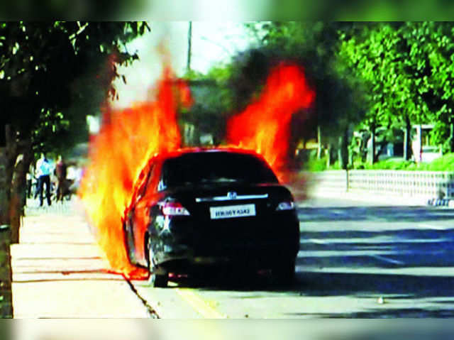 Car on fire triggers jam at Film City