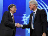 Bill Gates shakes hands with Bill Clinton