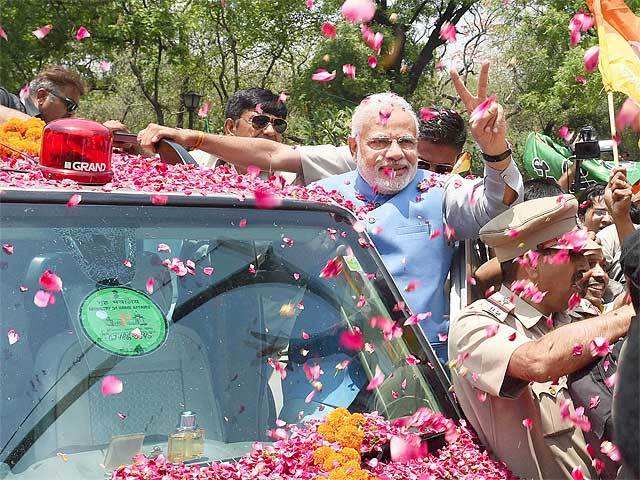 Modi waves victory sign to supporters