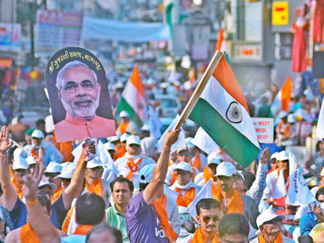 BJP supporters celebrate after Modi's swearing-in ceremony