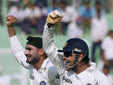 Harbhajan Singh and MS Dhoni celebrate