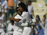 Dhoni and Ishant Sharma celebrate the fall of a wicket