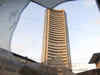 Sensex, Nifty end in red after hitting record high