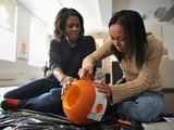 Cuyan & Cary carving Halloween pumpkins