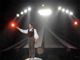 Firmin Grss stands on an elephant during circus show