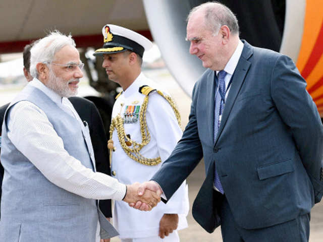 Narendra Modi being welcomed at the airport