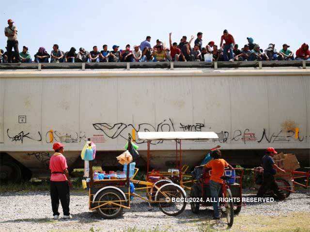 Central American immigrants sit atop the La Bestia