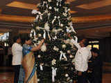 Employees decorate Christmas tree at Taj