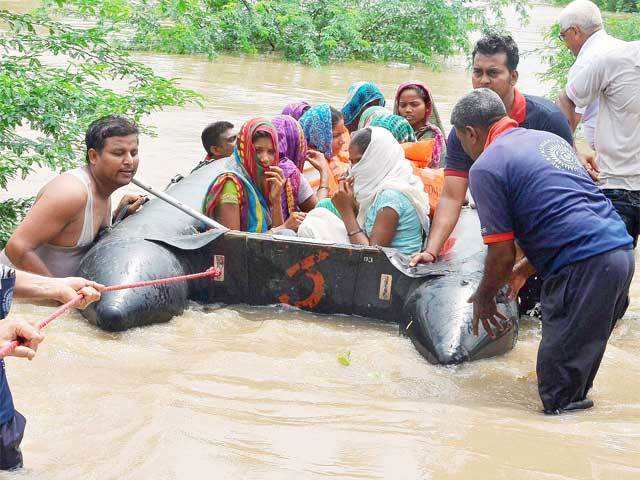 People rescued from a flooded village