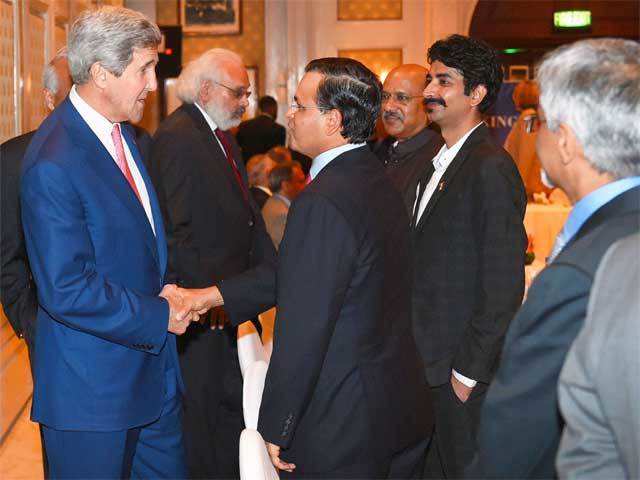 John Kerry during a business meeting