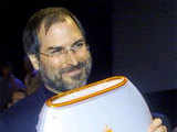 Apple's CEO Steve with  iBook portable computer