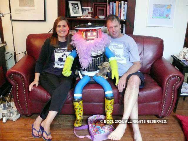 hitchBOT relaxes with its creators