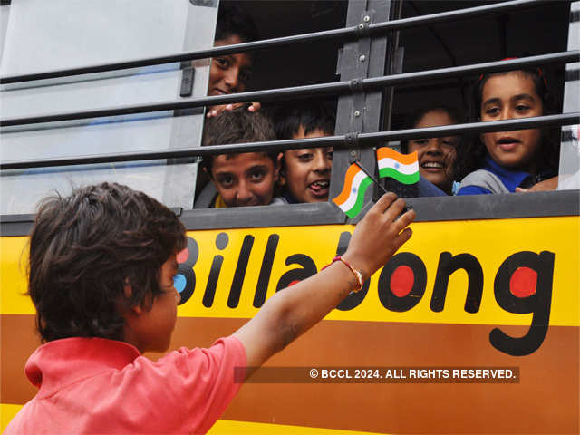 A less privileged boy selling flags to schoolchildren