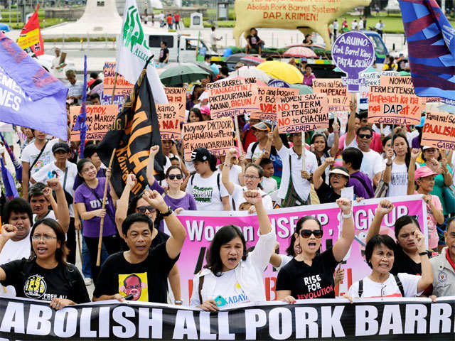 Filipinos take part in a rally in a street in Manila