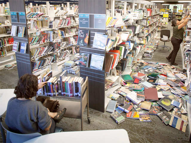 Library workers re-shelve books