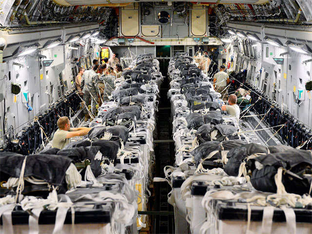 Squadron preparing 40 water bundles on a US C-17