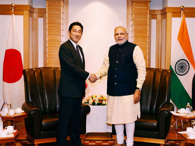 PM Narendra Modi shakes hands with Fumio Kishida